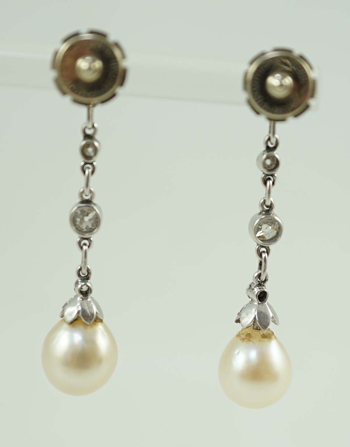 A pair of white gold, diamond and cultured pearl set drop earrings